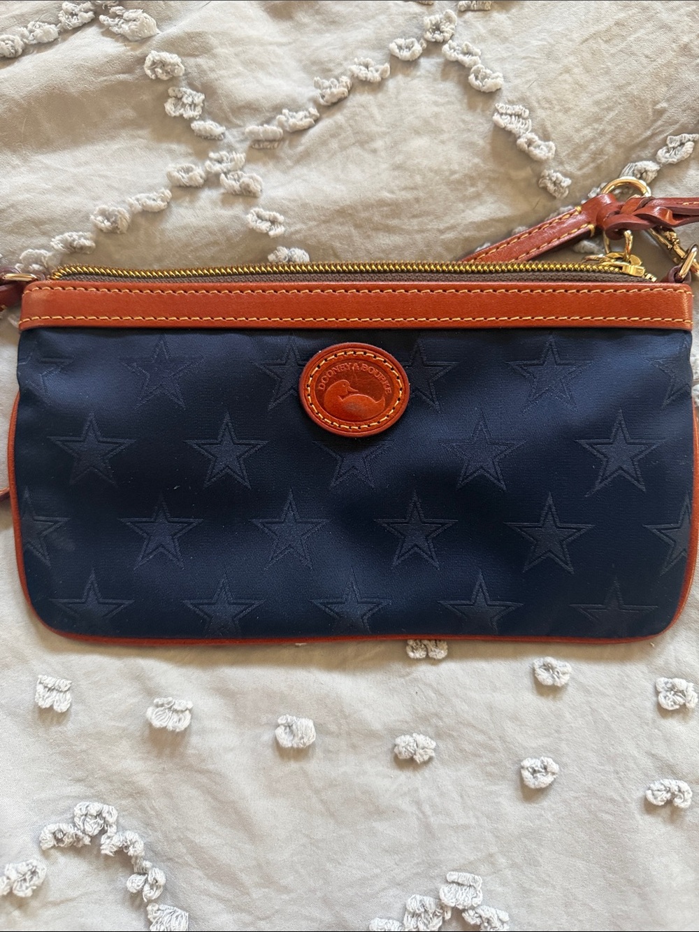 Dooney & Bourke Navy Star-Embossed Wristlet with Brown Trim